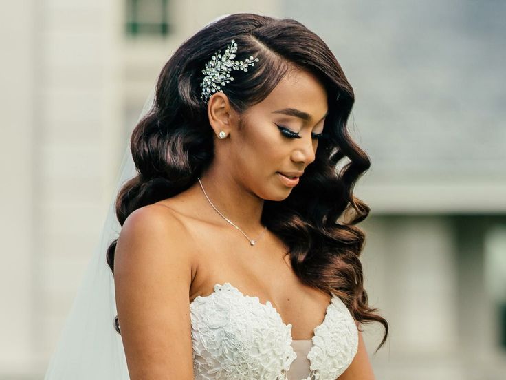 a woman in a wedding dress is looking down