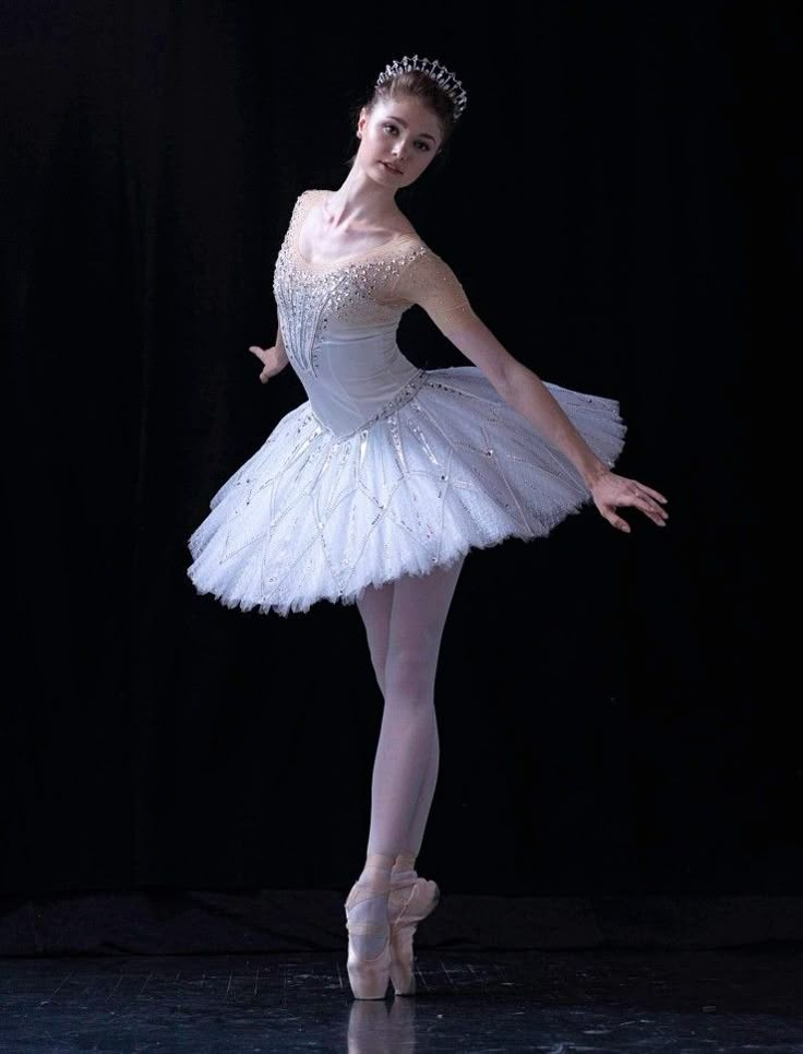 a ballerina in white tutu and tiara