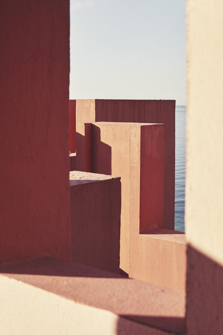 the view from behind some concrete blocks looking out at the ocean