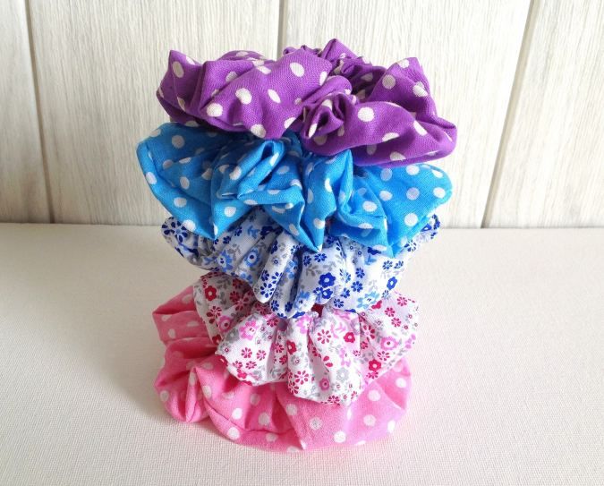 several different colored hair bows stacked on top of each other