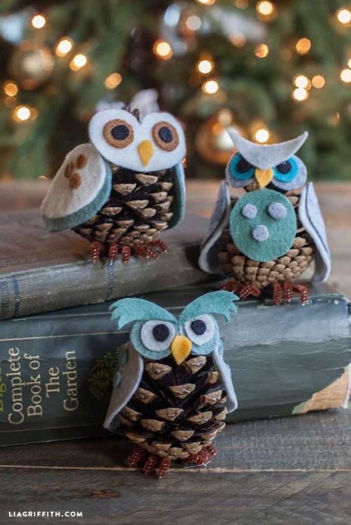 two stuffed owls sitting next to each other on a table