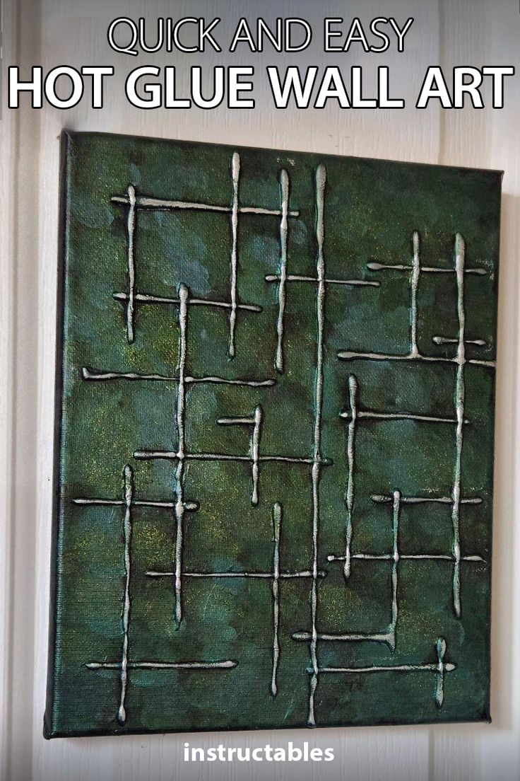 a green painting hanging on the side of a door