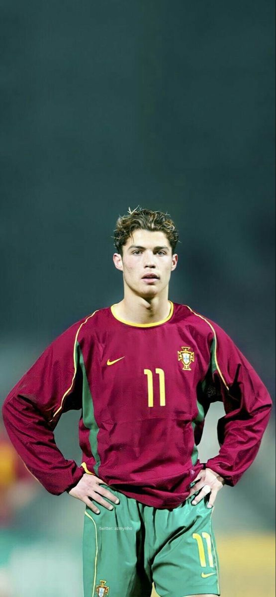 a soccer player is standing with his hands on his hips