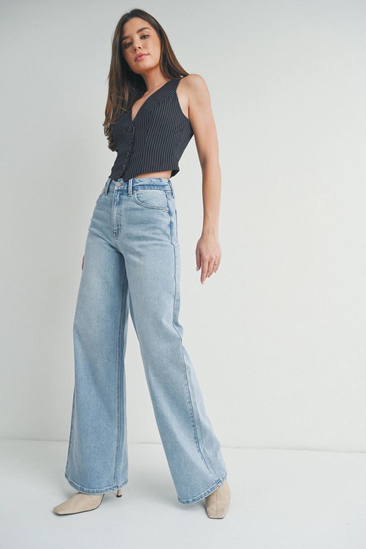 DescriptionThe Beatrice Light Wash Wide Leg Jeans feature: Light wash denim Wide leg, 12" Opening High-waisted fit, 11" Rise Longer length, 32.5" Inseam FitTrue to size, slight stretch. Material93% Cotton, 5% Spandex, 2% Spandex Light Wash Jeans Outfit, Light Wash Wide Leg Jeans, Wash Jeans Outfit, Crop Top Blouse, Light Wash Jeans, Wide Leg Denim, Light Wash Denim, Light Denim, Wash Jeans