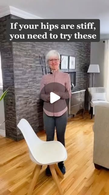 an older woman is standing in the living room