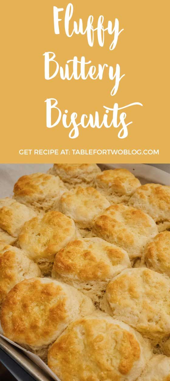 fluffy buttery biscuits in a baking pan with text overlay