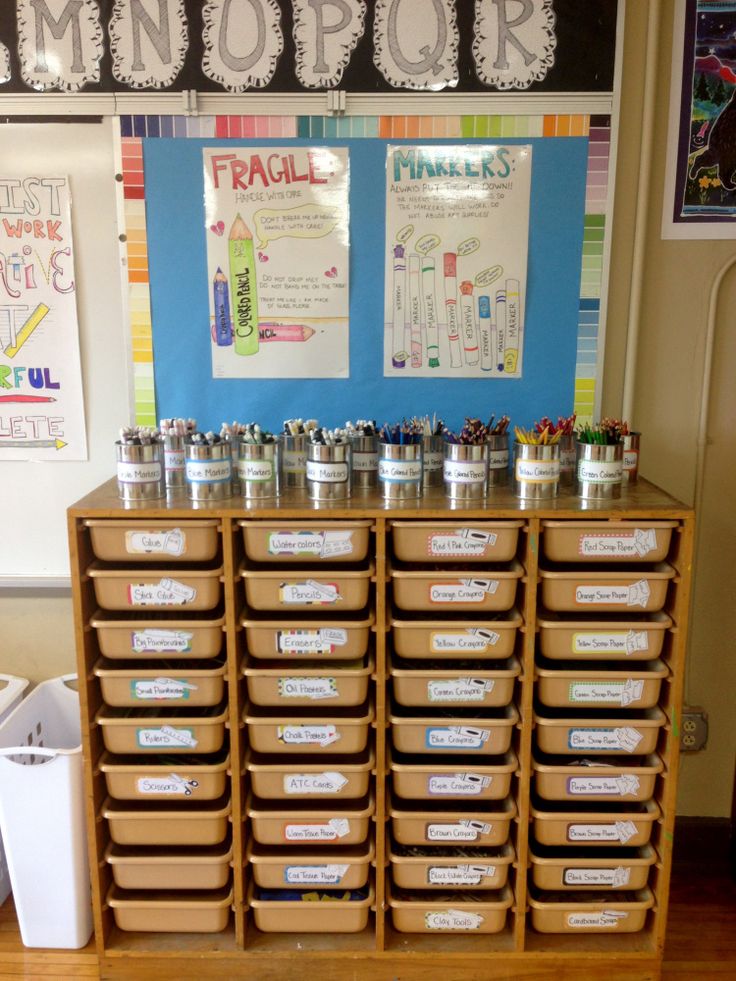 an organized classroom with lots of bins