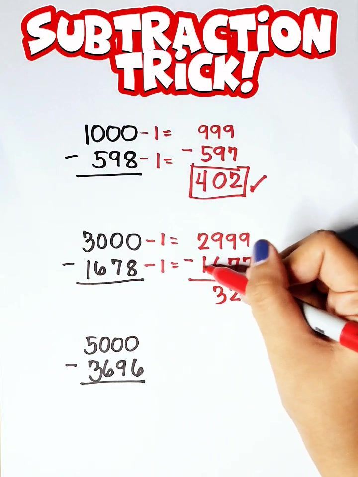 someone is writing subtraction tricks on a piece of paper