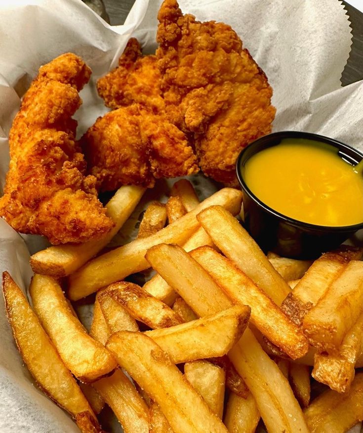 fried chicken and french fries with dipping sauce