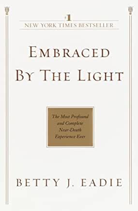 the book cover for embraced by the light, with an image of a gold plaque