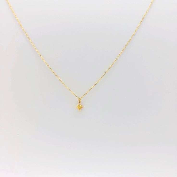 The Eight Point North Star Gold Necklace is our magic touch for your neckline. This jewelry piece adds a touch of sophistication to your look with your minimalist jewelry style. Crafted with a dainty, 14k gold filled chain and gold charm, this necklace is the perfect complement to any outfit, or any necklace layer. Crafted with precision, both chain and charm are gold filled yet light and comfortable for everyday wear. 14K gold filled chain 14k gold lobster clasp 18k vermeil gold star 16 & 18 in Minimalist Star Necklace For Everyday, Yellow Gold Star Charm Pendant Necklace, Dainty 14k Gold-filled Star Charm Jewelry, Minimalist 14k Gold Star Of David Necklace, Dainty Yellow Gold Star Of David Necklace, Minimalist Yellow Gold Star Of David Necklace, Minimalist Yellow Gold Jewelry With Star Charm, Dainty Gold Jewelry With Star Charm, Dainty Yellow Gold Star Charm Necklace