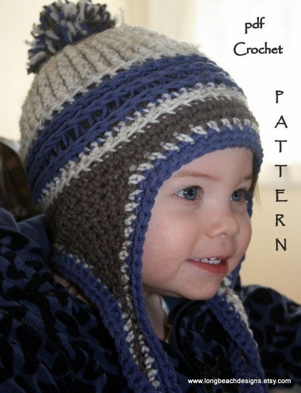 a young child wearing a crocheted hat and scarf