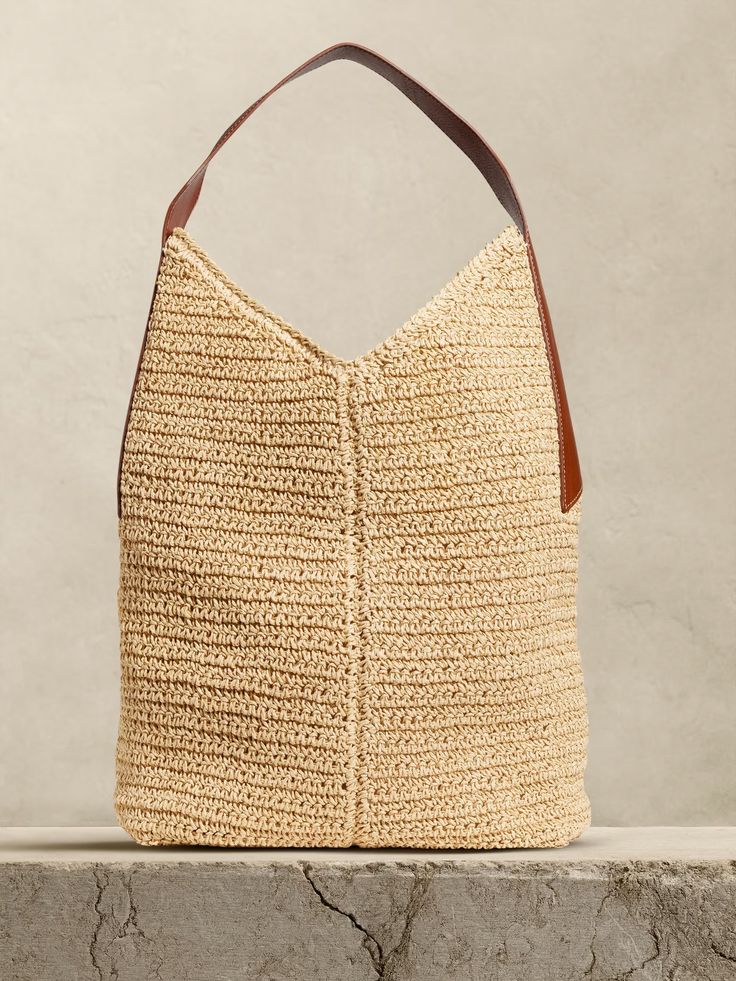 Slouchy Vida Straw Bag | Banana Republic Chic Neutral Tote Beach Bag, Chic Neutral Straw Bag, Chic Neutral Beach Bag, Summer Hobo Bag With Leather Handles For Vacation, Summer Vacation Hobo Bag With Leather Handles, Chic Beige Hobo Bag For Beach, Versatile Woven Tote Bucket Bag, Chic Woven Leather Top Handle Beach Bag, Summer Beige Hobo Bag With Braided Handles