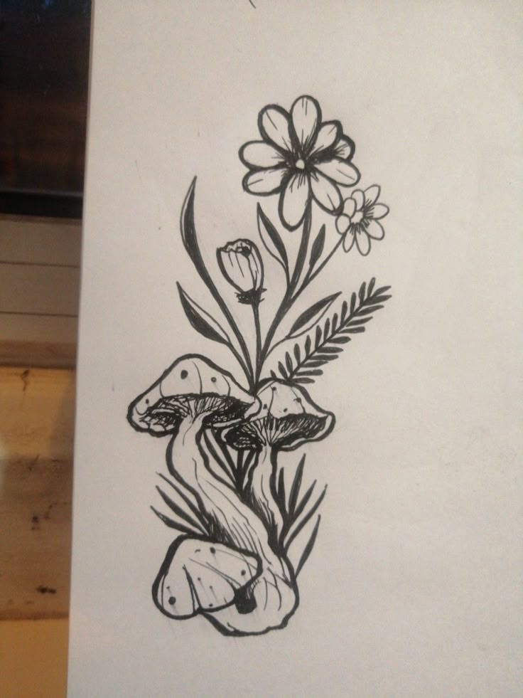 a black and white drawing of flowers on a piece of paper