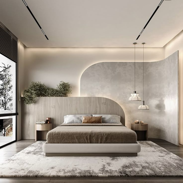 a large bed sitting in the middle of a bedroom next to a tall white wall