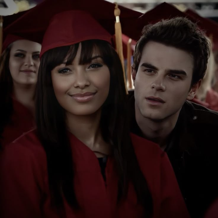 a group of people in graduation caps and gowns