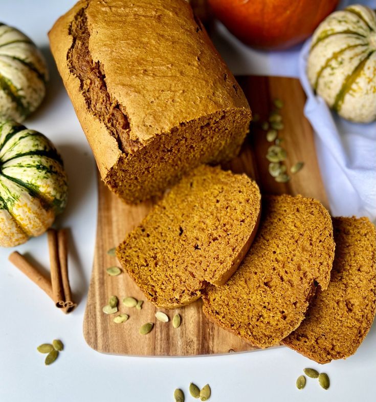 pumpkin spiced bread sliced on a cutting board