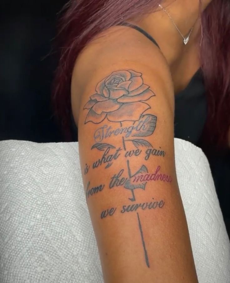 a woman with red hair has a rose tattoo on her arm and the words, what we grow from the sunshine are supreme