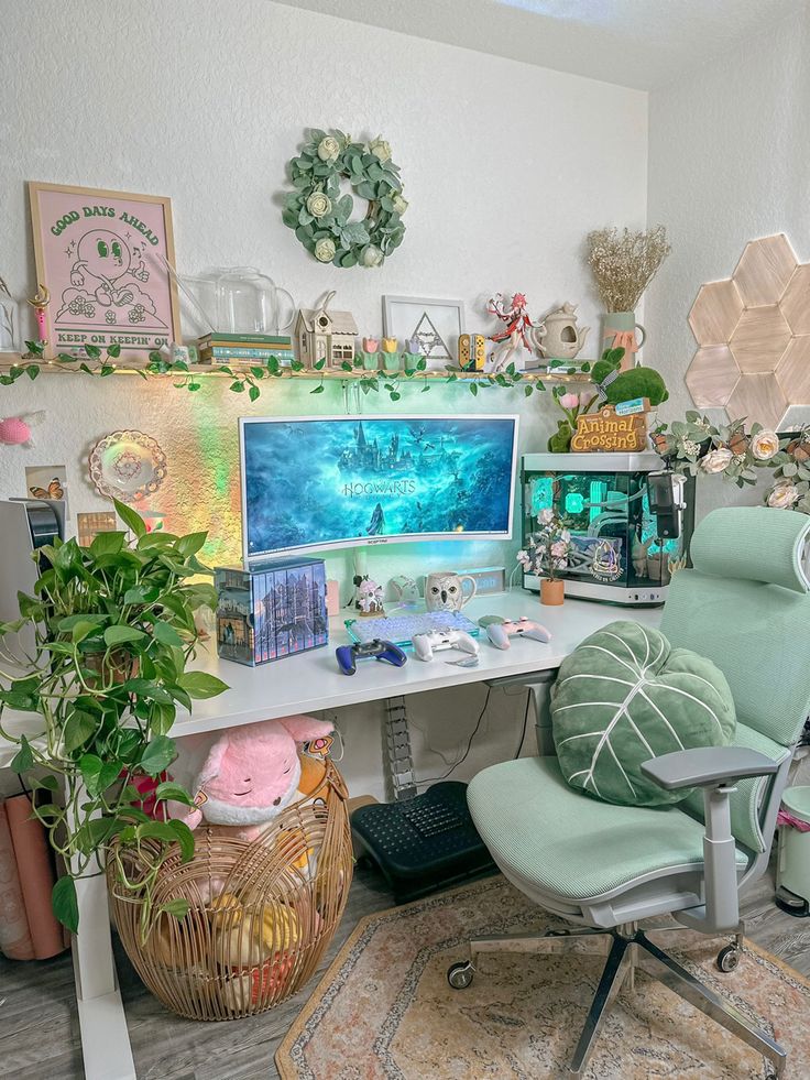 a computer desk topped with a desktop computer next to a green chair and potted plant