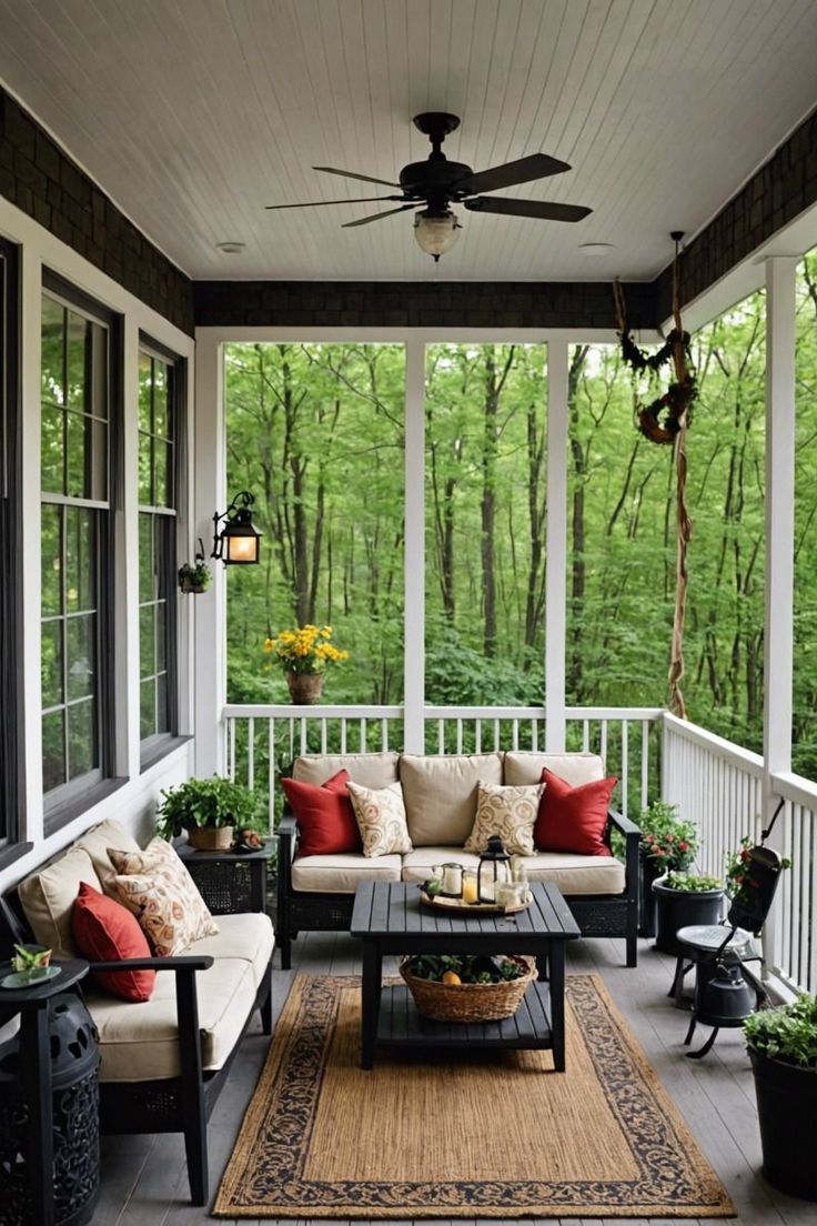 a porch with couches, tables and potted plants on the front porch area