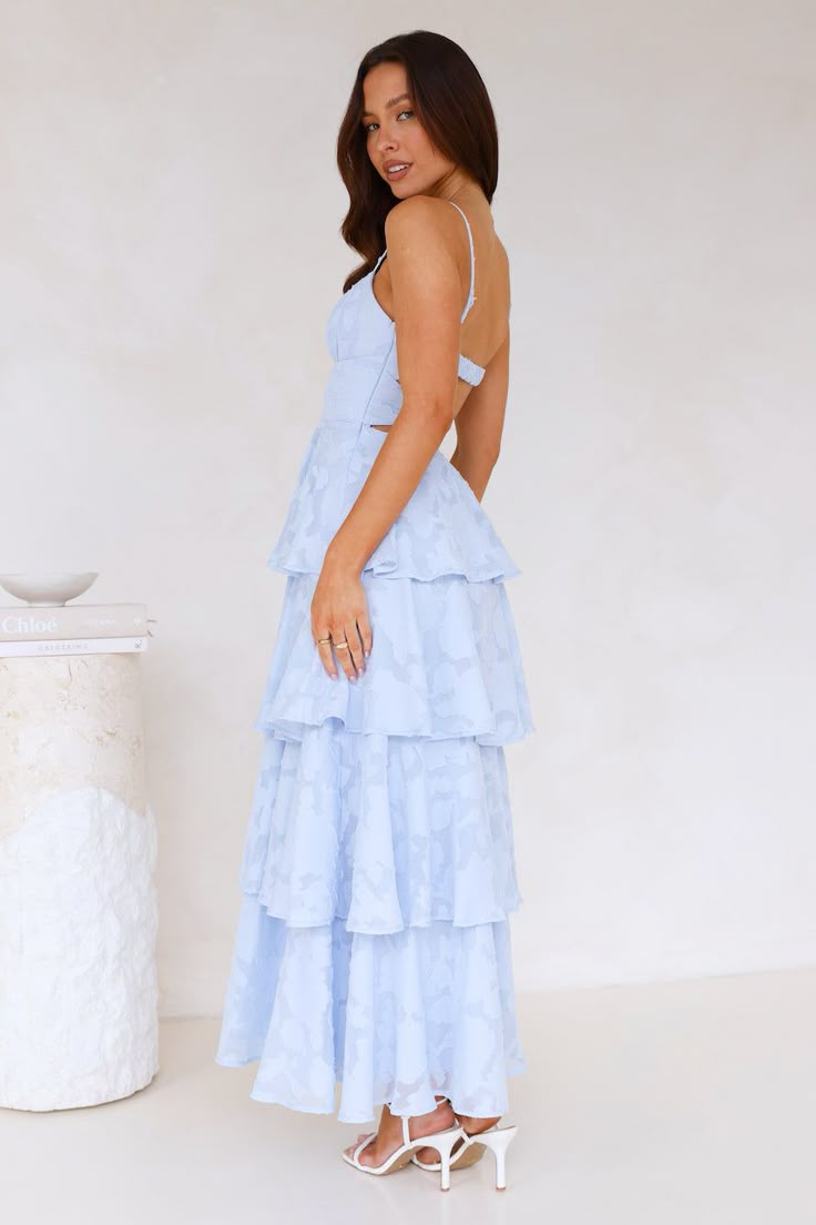 Length from shoulder to hem of size S: 122cm. Chest: 38cm, Waist: 32cm, across front only of size S. Maxi dress. Semi-lined. Model is a standard XS and is wearing size XS. True to size. Non-stretch. Tiered frill skirt. Elastic back. Textured design. Adjustable shoulder straps. Zipper. Cold hand wash only. Polyester/Spandex. Be seen in a dreamy style, lovely! The Thriving Now Maxi Dress features a tiered frill skirt, an elastic back, and adjustable shoulder straps. Style with heels for a 'fit we' Long Dresses For Senior Pictures, Pretty Blue Prom Dresses, Prom Dresses Loose, Blue Maxi Bridesmaid Dress, Light Blue Prom Dress Long, Blue Wedding Guest Dress, Light Blue Maxi Dress, Cute Maxi Dresses, Pastel Blue Dress