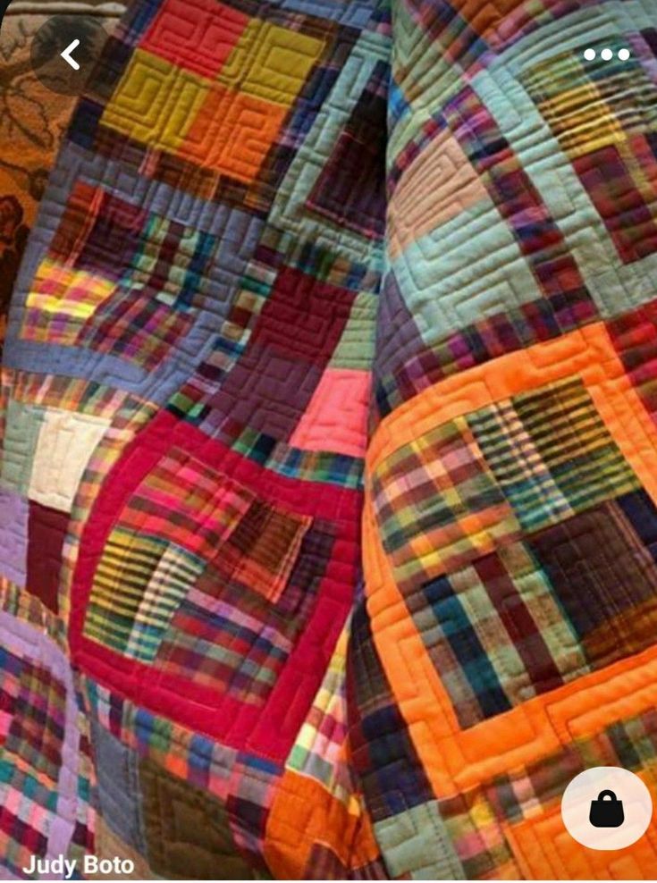 an image of a colorful quilt on display