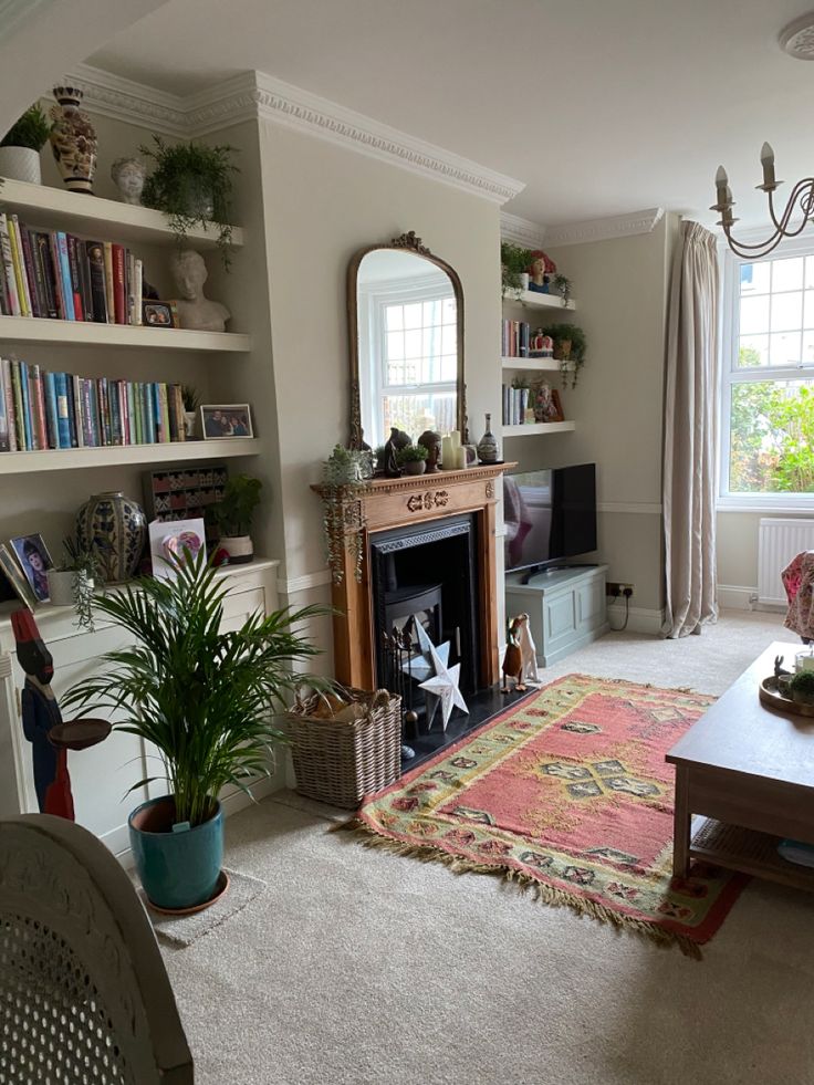 a living room filled with furniture and a fire place