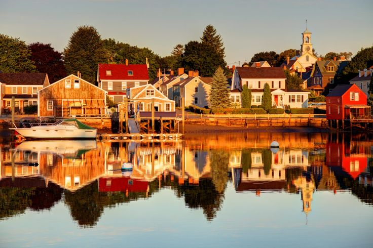 boats are docked in the water next to houses