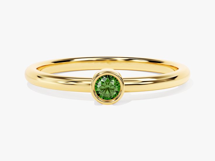 Our Bezel Set Round Emerald Ring in 14K Solid Gold is a celebration of love and protection and the enchanting beauty of Emeralds. This elegant ring features a stunning round-cut Emerald, renowned for its fascinating green hue. Emeralds are more than just gemstones; they are known as protectors of lovers and evoke the heart chakra, making receiving and giving love easier for the wearer. Spiritually, Emeralds offer a shield of protection against negativity and promote love and harmony. Luxury Green Birthstone Ring For May, Luxury Green May Birthstone Ring, Green Diamond Birthstone Ring With Round Band, Anniversary Green 14k Gold Stackable Rings, Green Brilliant Cut Round Band Ring, Formal Green Stackable Rings, Luxury Green Ring With Bezel Setting, Luxury Round Diamond Ring For May Birthstone, Fine Jewelry Emerald Promise Ring