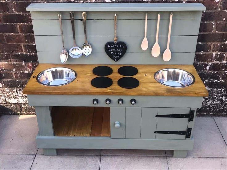 an old fashioned stove with lots of cooking utensils