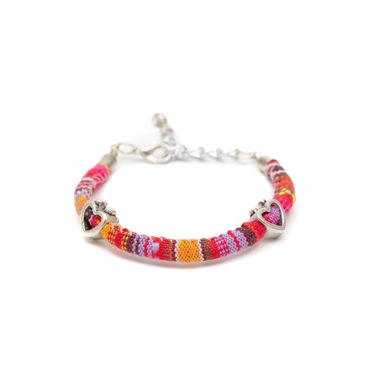 These fun, casual, and gorgeous bracelets are one of our best sellers and are perfect for adding some 'boho flair' to any outfit! Each piece features beautiful and colorful Guatemalan fabric wrapped around a bracelet that is detailed with silver beaded accents. Wear one or stack them - collect them all! As always... Handmade and Fair Trade! 7 1/2" L 100% Cotton Fabric Silver Beads and Clasp Colors/Patterns Will Vary Price is for one random Bohemian Fabric and Bead Bracelet WARNING: CHOKING HAZAR Bohemian Silver Hand-strung Friendship Bracelets, Bohemian Pink Beaded Bracelets With Heart Beads, Pink Bohemian Beaded Bracelets With Heart Beads, Bohemian Jewelry With Silver Beads For Friendship, Bohemian Silver Beaded Jewelry For Friendship, Hippie Multicolor Beaded Wrap Bracelet, Hippie Colorful Beaded Summer Bracelets, Multicolor Heart Beads Stretch Bracelet, Adjustable Multicolor Beaded Chain Bracelets