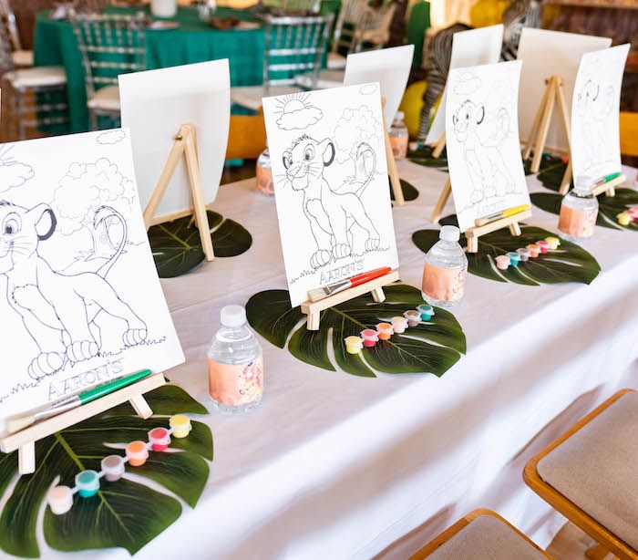 the table is set up with drawings for children to draw