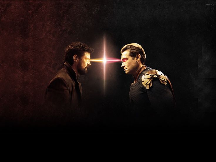 two men are facing each other in front of a red background and one is holding a light saber