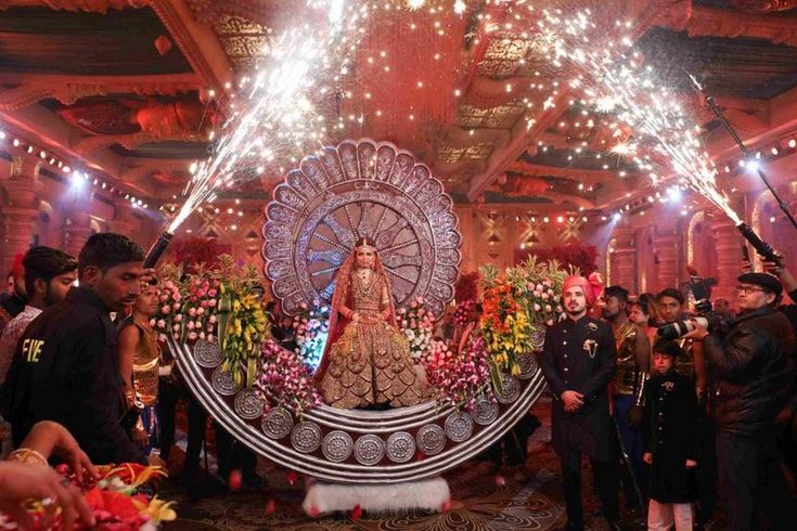 the bride and groom are surrounded by fireworks