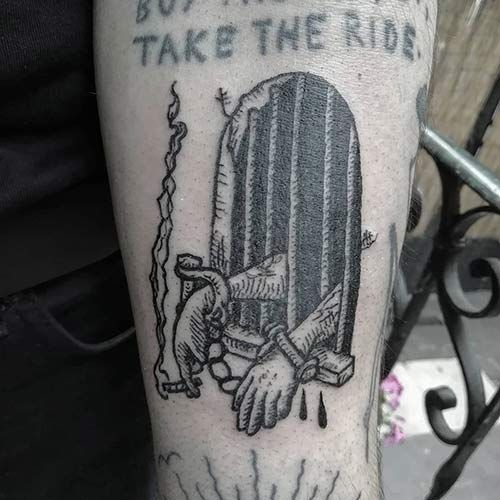 a man with a tattoo on his arm that says, but the door to take the ride