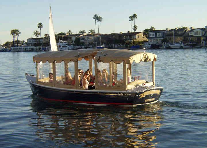 a group of people riding on the back of a boat