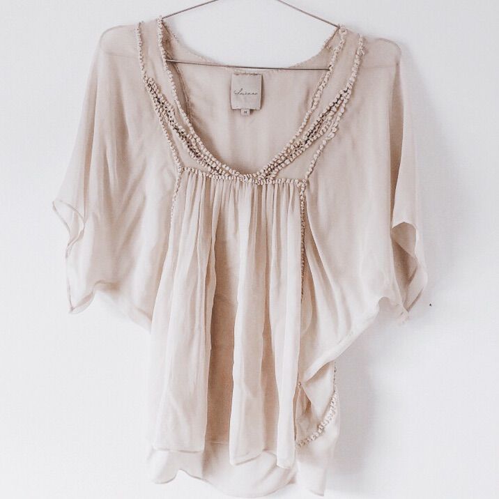 Beautiful Top. Sheer So You Will Want To Wear Something Under. Beautiful Details. Wonderful Condition. Never Worn Reasonable Offers Will Be Considered. _ Get $5 Off Your First Purchase On Poshmark By Using Code Nativeasfolk At Signup! Neutral V-neck Beach Top, Feminine Flowy Beige Tops, Flowy Feminine Beige Tops, Beige Lace Top Blouse For Beach, Beige Lace Top Blouse For The Beach, Bohemian Embellished V-neck Blouse, Elegant Neutral V-neck Top, Elegant Beige Beach Tops, Elegant Embellished Summer Top