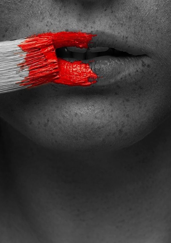 a woman's lips are painted red and white