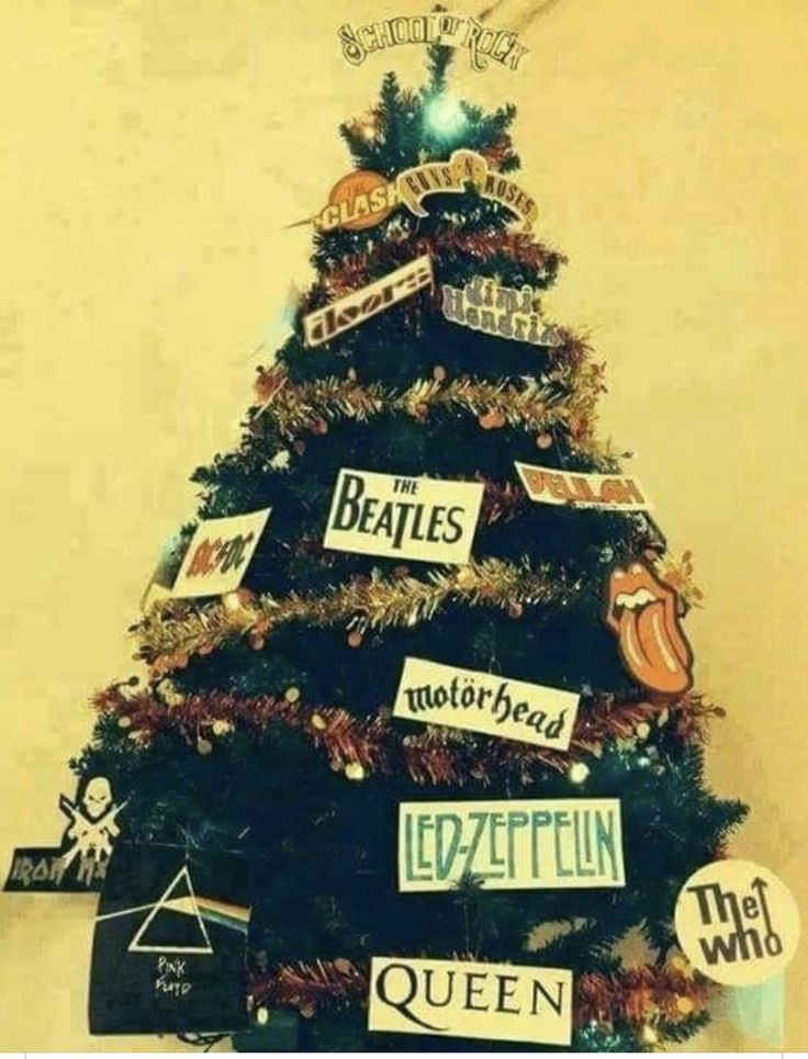 a christmas tree decorated with many different types of stickers on it's sides