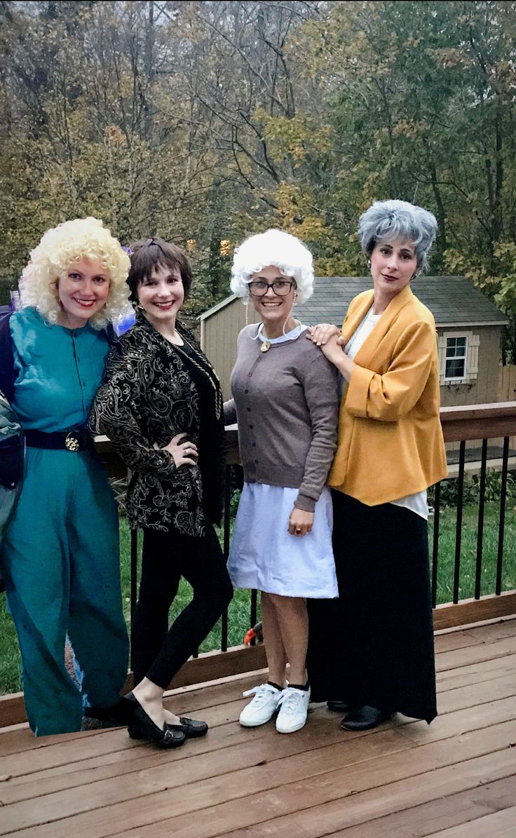 three women are standing on a deck with their arms around each other