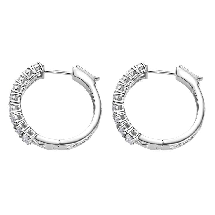 These moissanite hoop earrings feature double rows of sparkling gems, meticulously set in sterling silver for a refined, luxurious look. The design of the hoops optimizes light reflection, infusing a touch of glamour into any ensemble. Crafted with attention to detail, these silver earrings seamlessly blend modern elegance with timeless sophistication.     Details      Hoop earrings for women, symbolizing strength and identity Adorned with a double row of radiant moissanite gems A lab-created gem celebrated for its brilliance Round shape gems securely prong set Closely arranged for maximum sparkle Features a hinged hoop clasp for easy wear Crafted in durable sterling silver Hypoallergenic earrings, ideal for sensitive skin A perfect silver jewelry gift for loved ones Radiant Moissanite, Hypoallergenic Earrings, Light Reflection, Modern Elegance, Easy Wear, Earrings For Women, Round Shape, Prong Setting, Jewelry Gift