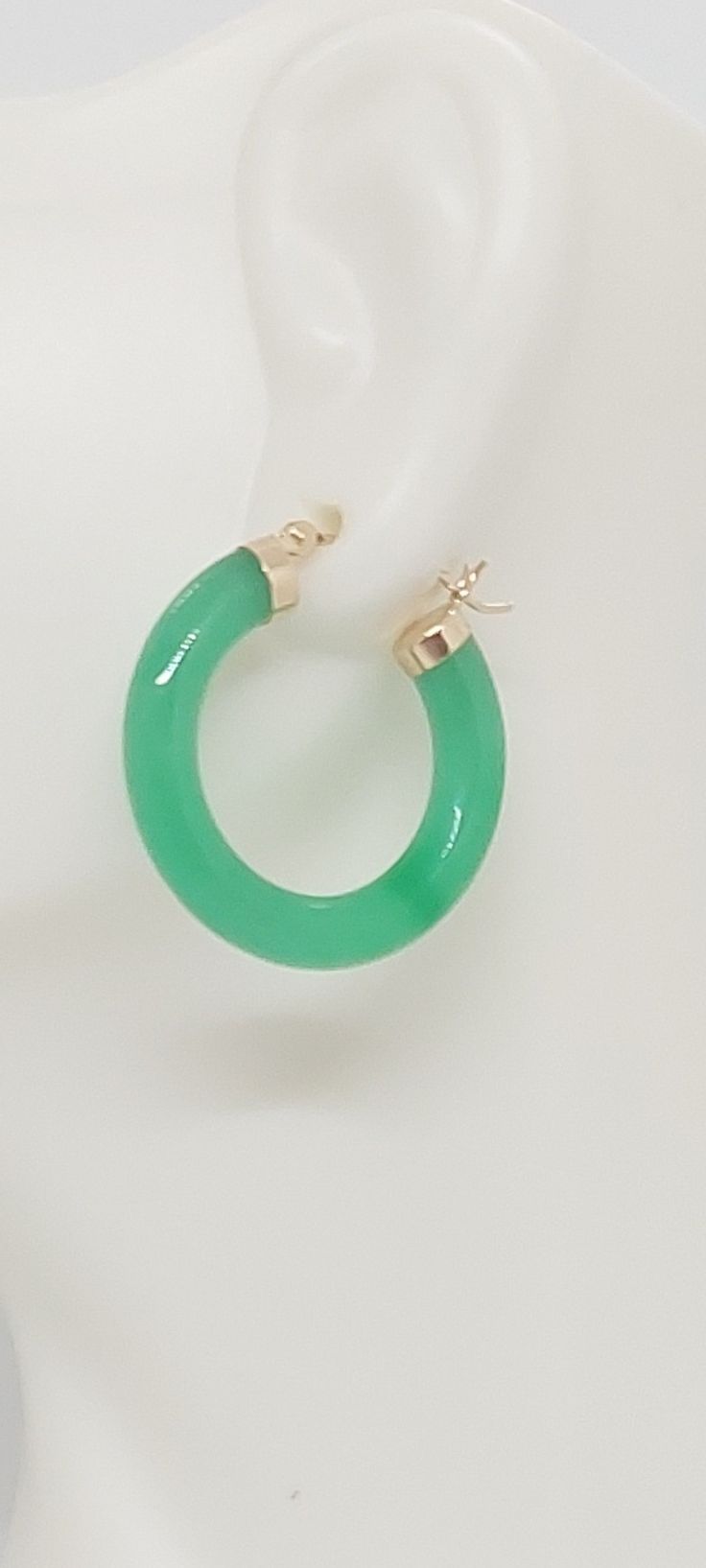 GREEN Jade Hoop Earrings in 14K Yellow Gold. 24 millimeters. Green Jade 14k Yellow Gold Hoop Earring. JADE Lover. Product Info: -Earring diameter: 24 millimeters -Metal: 14K. -Stone: Green Jade. -Colors: Green. -Finish: 14k Yellow gold. -Stone dimension: 4mm -Nice Gift box is included. Green Jade Hoop Jewelry, Green 14k Gold Hoop Earrings, Green Hoop Earrings Gift, Green Hoop Earrings For Gift, Green Pierced Hoop Earrings, Green May Birthstone Hoop Earrings, Small Green Pierced Hoop Earrings, Green 14k Gold Fine Jewelry Hoop Earrings, Green 14k Gold Hoop Earrings Fine Jewelry