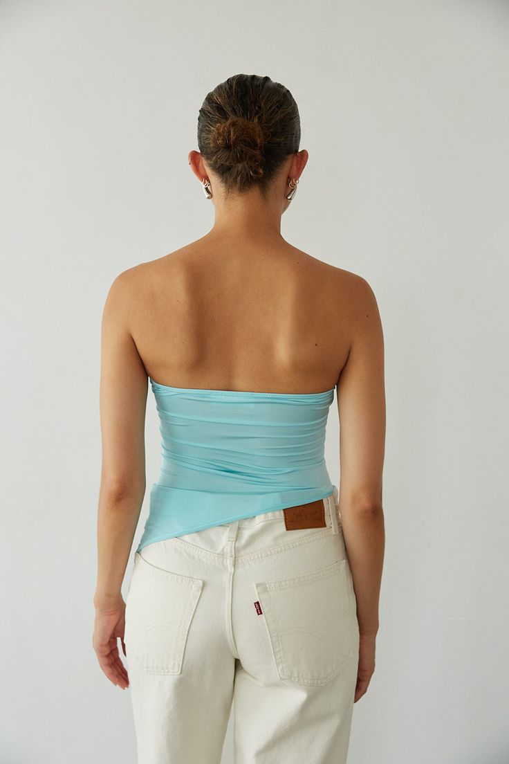 Slip into color in the Callie Asymmetrical Twist Front Tube Top for a splash of Summer freshness! This crop top features a twist front detail, asymmetrical hem, and tube top fit! Available in Bright Yellow and Aqua Blue; pair this top with your go-to denim to polish off the outfit!Details: 95% Polyester, 5% Spandex Lots of Stretch Hand Wash Cold/ Line Dry Summer Ruched Top With Asymmetrical Hem, Summer Ruched Tops With Asymmetrical Hem, Ruched Top With Asymmetrical Hem For Summer, Summer Tops With Ruched Asymmetrical Hem, Trendy Fitted One Shoulder Top With Ruched Detail, Ruched Tops With Asymmetrical Hem For Summer, Trendy Fitted One-shoulder Top With Ruched Detail, Summer Tops With Ruched Asymmetrical Neckline, Fitted Ruched Top With Asymmetrical Hem