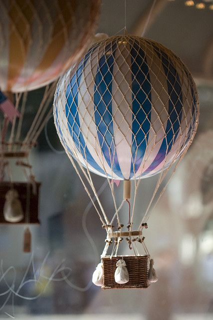 three hot air balloons are flying in the sky