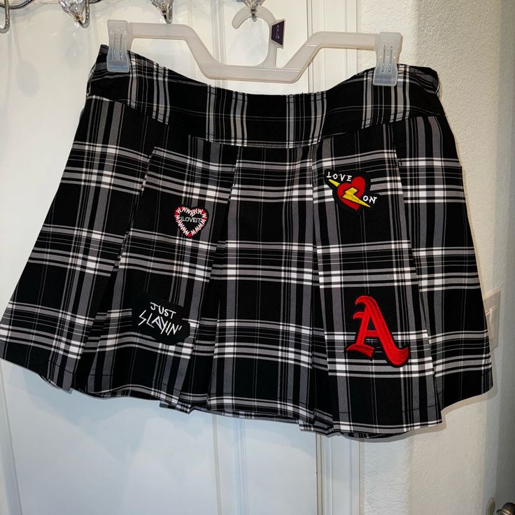 Cuteee Plaid Skirt!!! Brand New! (Tags Attached) Black/White With Patches. No Shorts Underneath. Size Xxl (19) Walmart Brand. Minimal To No Stretch. Zipper On The Side. Y2k Style Skirt For School, Trendy Black Skort For School, Y2k Style Black School Skirt, Trendy Skirted Bottoms For School, Casual Black Cotton Tennis Skirt, Edgy Mini Skirt Bottoms For School, Black Casual Short Skirt, Casual Black Shorts With Lined Skirt, Rock Style Pleated Skirt Bottoms