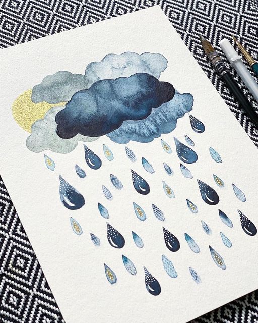 a drawing of a cloud with rain drops on it and two markers next to it