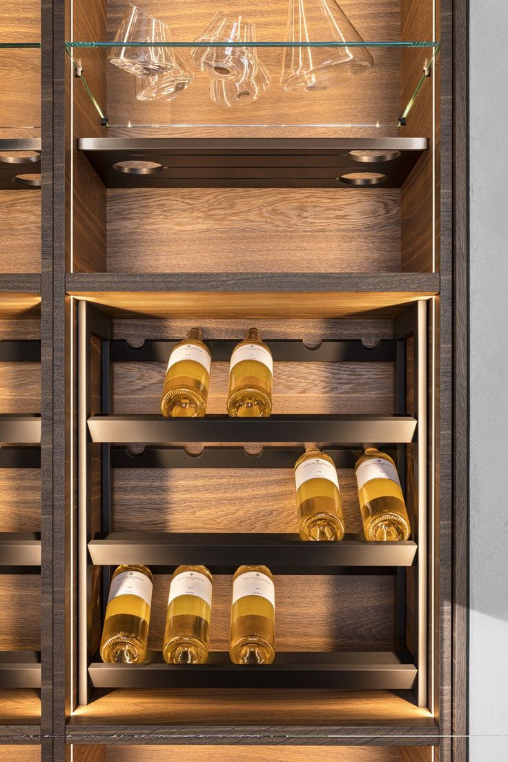 a wooden cabinet filled with lots of wine glasses