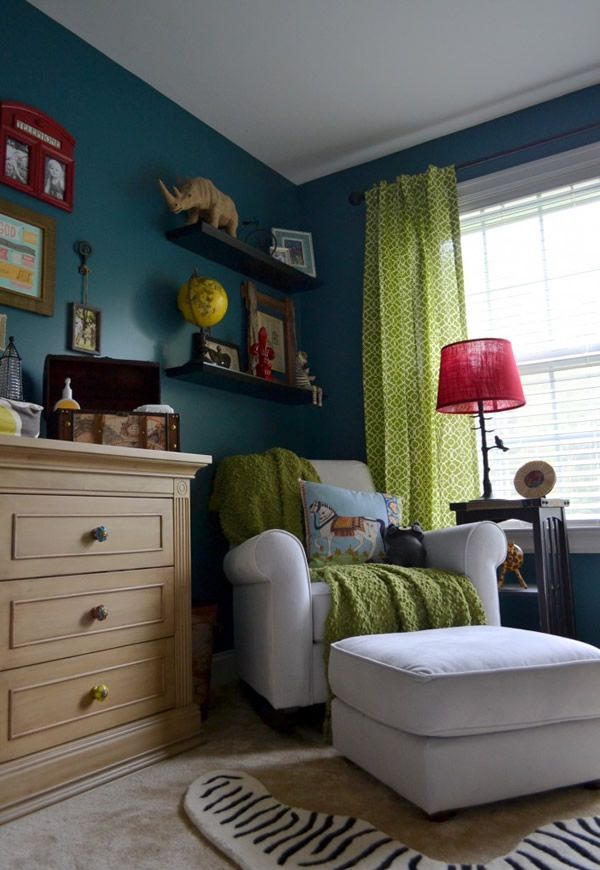 a living room filled with furniture and a zebra rug on the floor next to a window