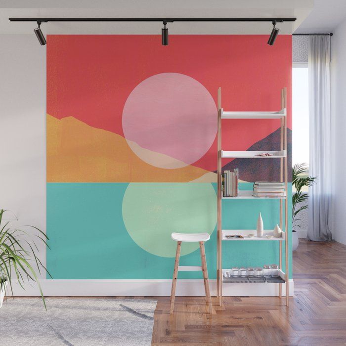 an abstract painting on the wall in a living room