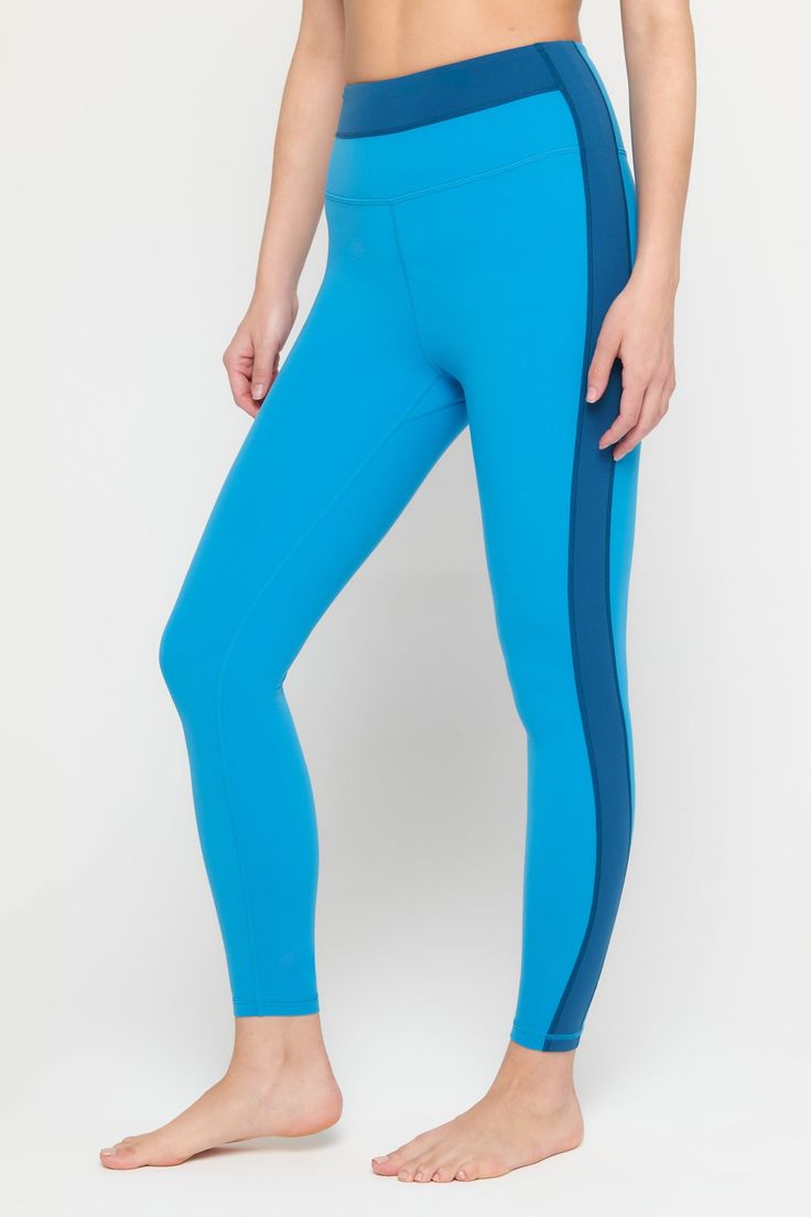 Meet your wear-everywhere leggings. Pair them with a cozy sweater, oversized tee, or with the cutest matching Aurora workout bra. Anyway you spin it, these sculpting, moisture-wicking wonders are the ready for the occasion. Squat-proof and lifting ready Ultra-flattering, sculpted compression Comfort-driven flatlock seams Breathable and moisture-wicking Contrasting colorblock design | Leighton Colorblock Legging in Azul Color Block Athleisure Bottoms For Yoga, Athleisure Color Block Yoga Bottoms, Blue Sporty Activewear With Elastic Side Panels, Sporty Blue Activewear With Elastic Side Panels, Blue Activewear With Elastic Side Panels For Sports, Athleisure Activewear For Running With Elastic Side Panels, Sporty Yoga Bottoms With Color Block, High Stretch Color Block Leggings For Workout, Stretch Color Block Sportswear Activewear